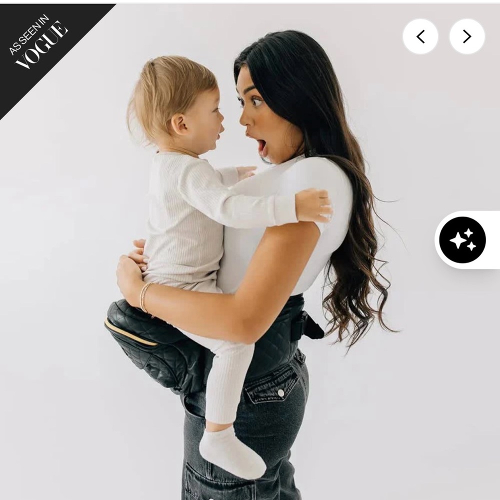 TushBaby carrier black with gold details